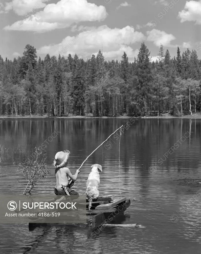 1950S Boy Huck Finn Style On Homemade Raft With Dog Fishing In