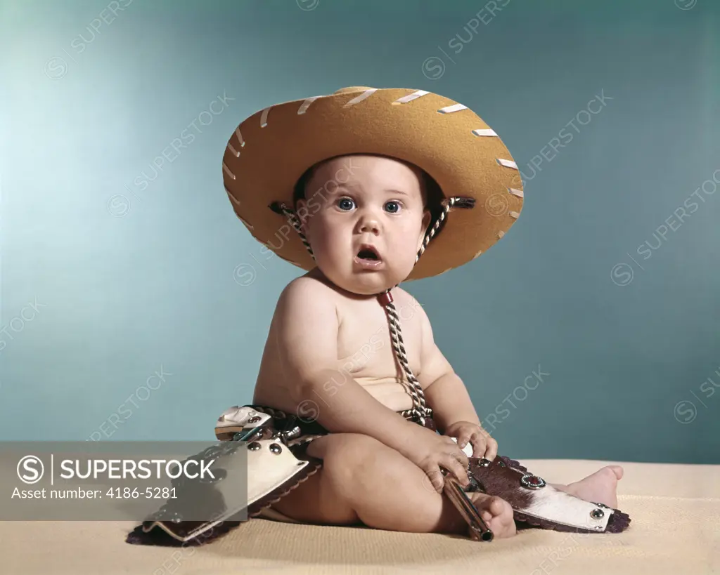 1960S Baby Wearing Cowboy Costume With Funny Facial Expression