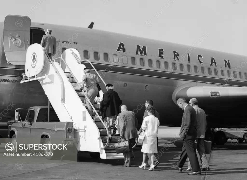 1960S Passengers Boarding American Airlines Astrojet By Way Of Short Stairway Raised From Bed Of Pickup Truck