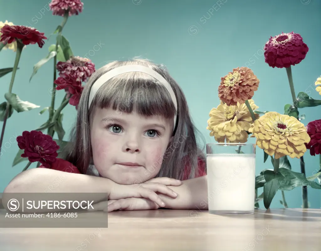 1950S Cute Thoughtful Girl Bangs White Headband Leaning Arms & Head On Table Glass Of Milk Flowers Zinnias Behind