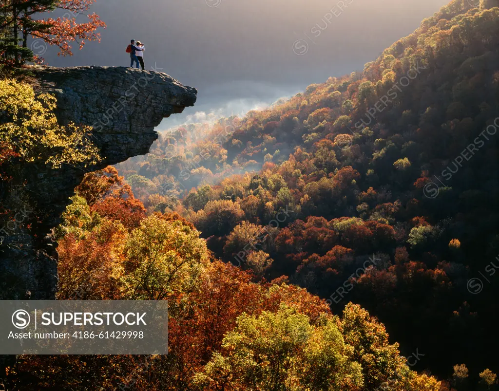 TWO PEOPLE HIKERS ON WHITAKER POINT IN UPPER BUFFALO RIVER WILDERNESS AREA OZARK NATIONAL FOREST NEAR BOXLEY ARKANSAS