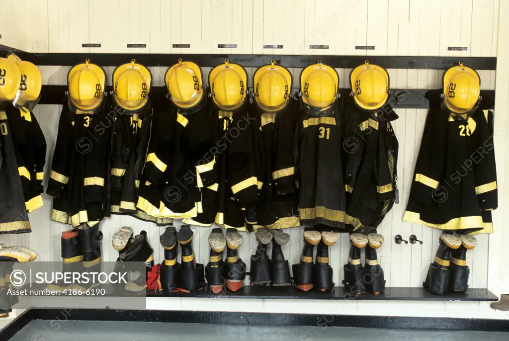 1990S Firefighter Gear Hanging In Firehouse