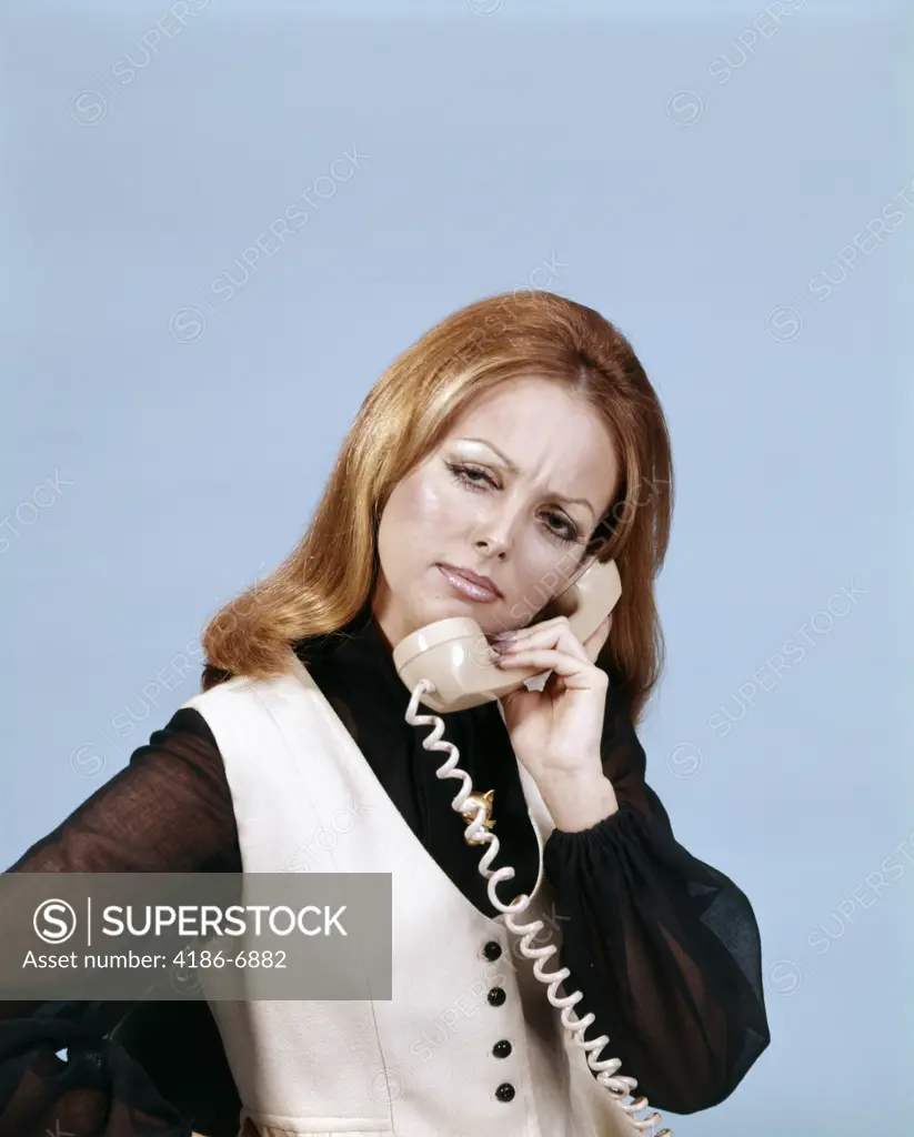 1970S Frowning Woman Talking On Telephone