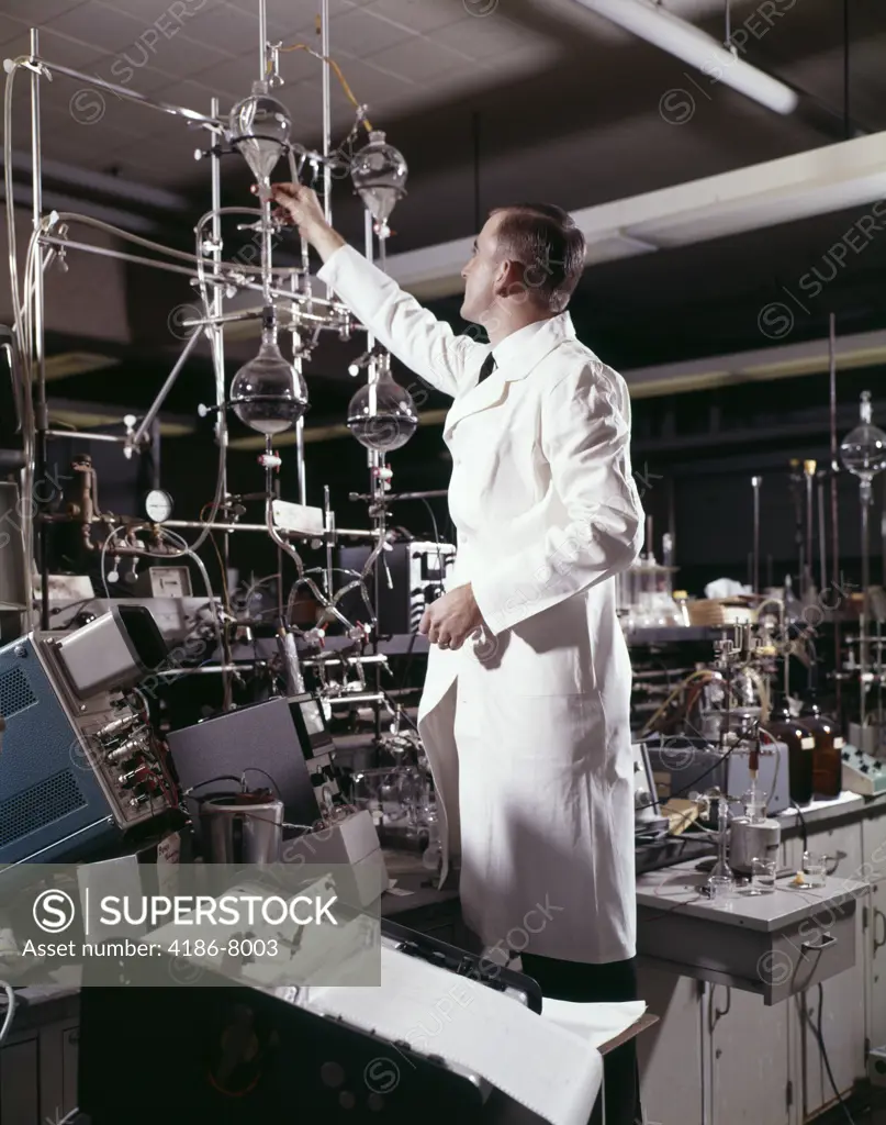 1960S Laboratory Technician Conducting A Titration Test Science Experiment Elaborate Precision