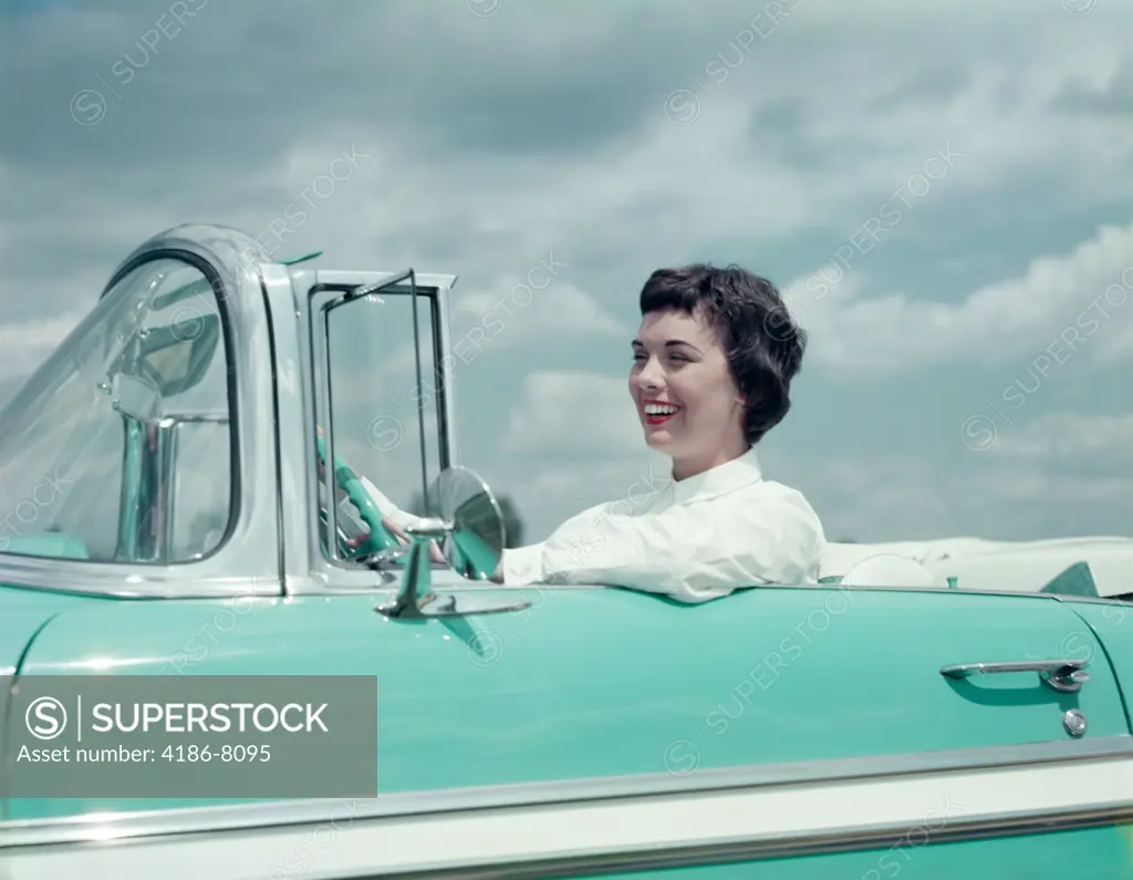 1950S Smiling Brunette Woman Driving Turquoise And White 1955 Chevrolet Convertible Automobile