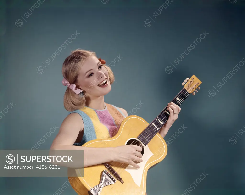 1960S Young Girl Playing Guitar