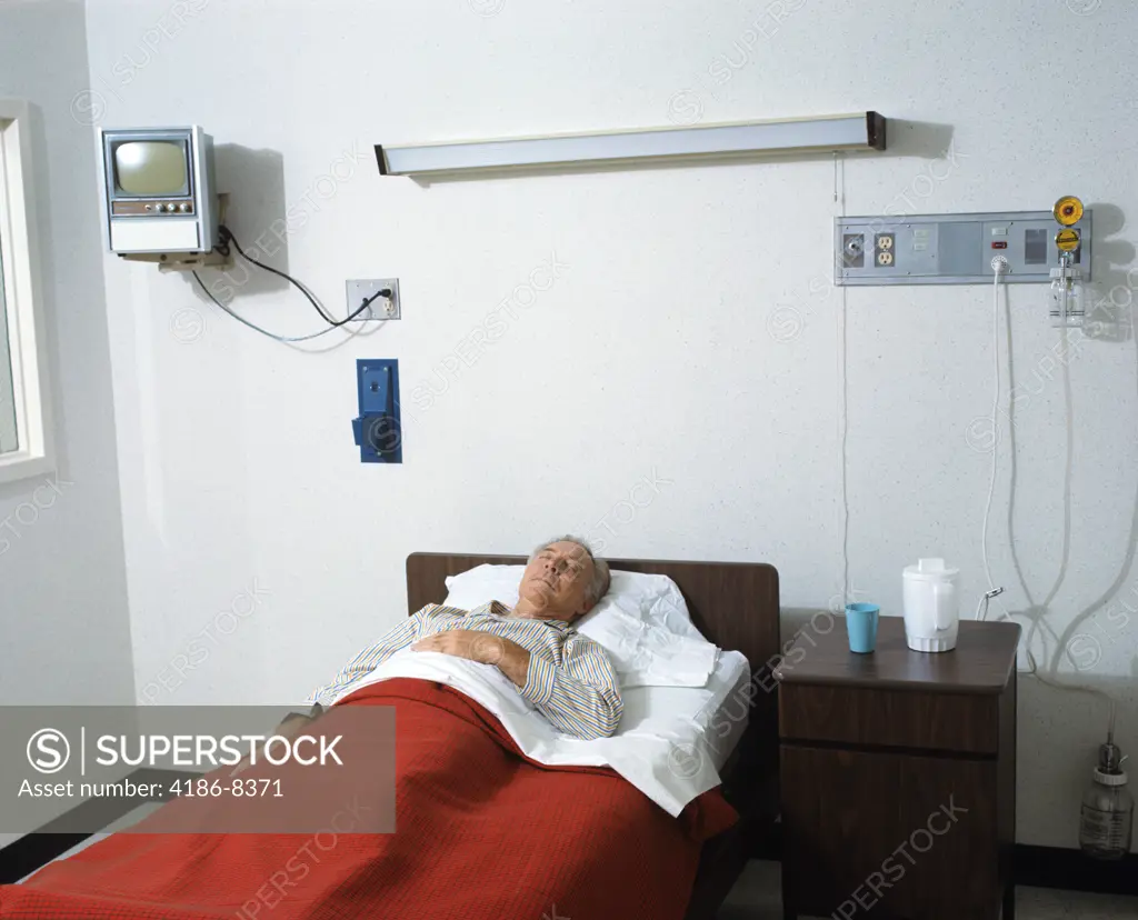 1970S Senior Man Lying In Hospital Bed