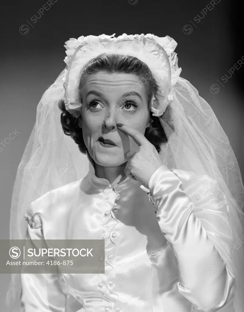 1950S Bride Scratching Nose And Looking Up