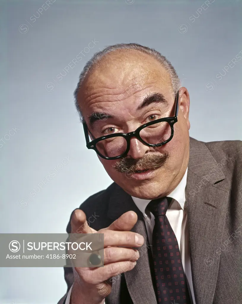 1960S Balding Elderly Man Eyeglasses Moustache Pointing Finger