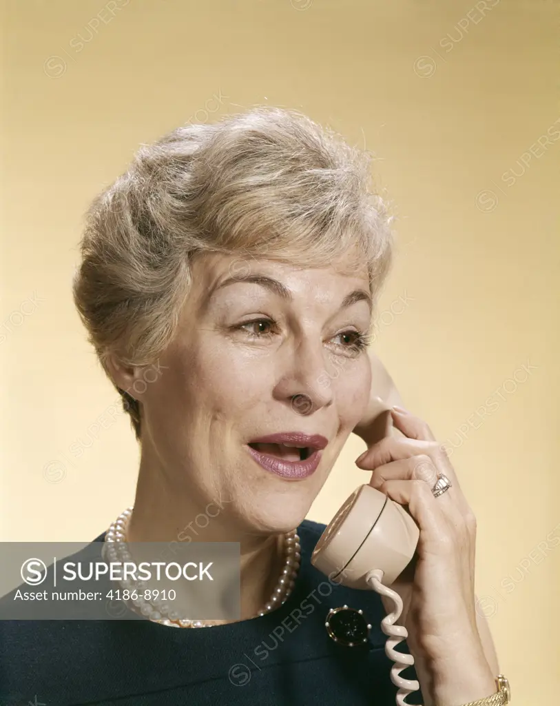 1960S Smiling Happy Senior Woman Talking On Telephone