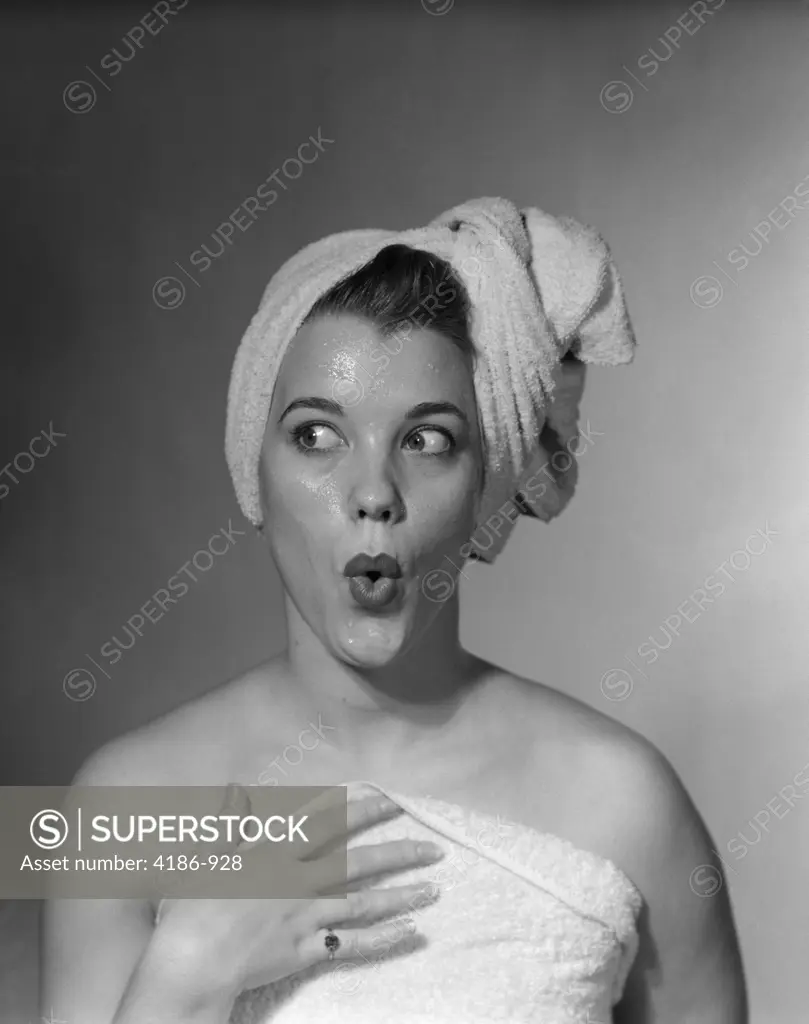 1950S Woman Making Funny Face Expression Wearing Towel On Head Looking Off To The Side