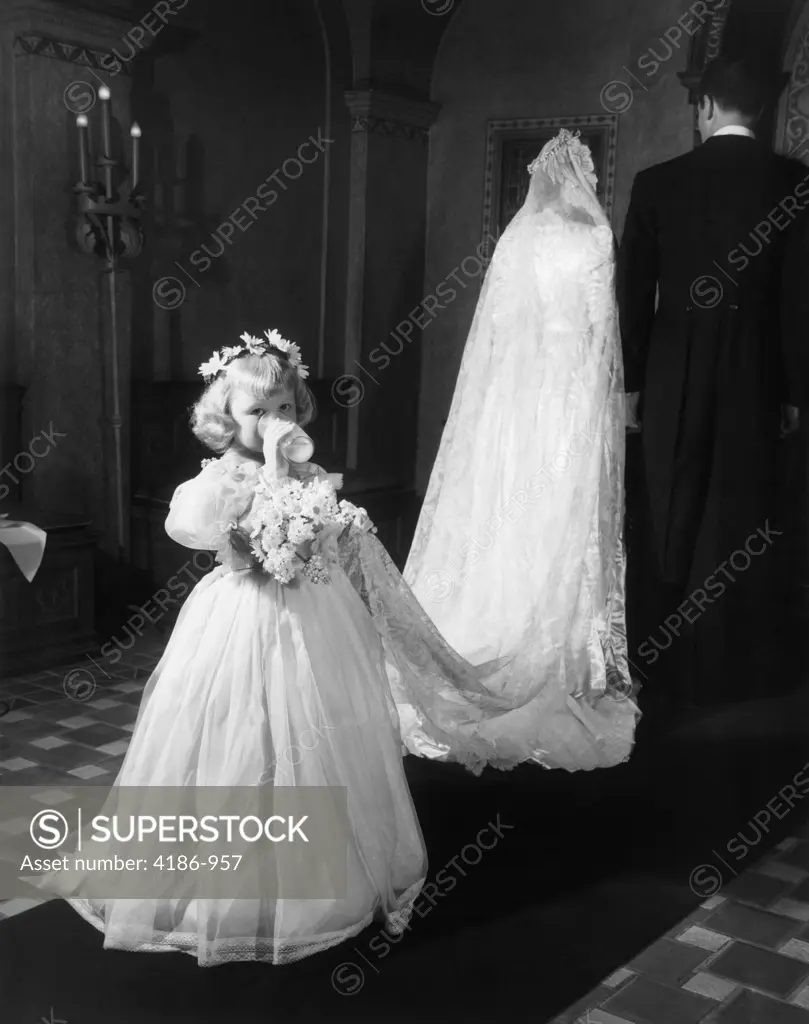 1950S Little Girl Bridesmaid Drinking Glass Of Milk Holding Bridal