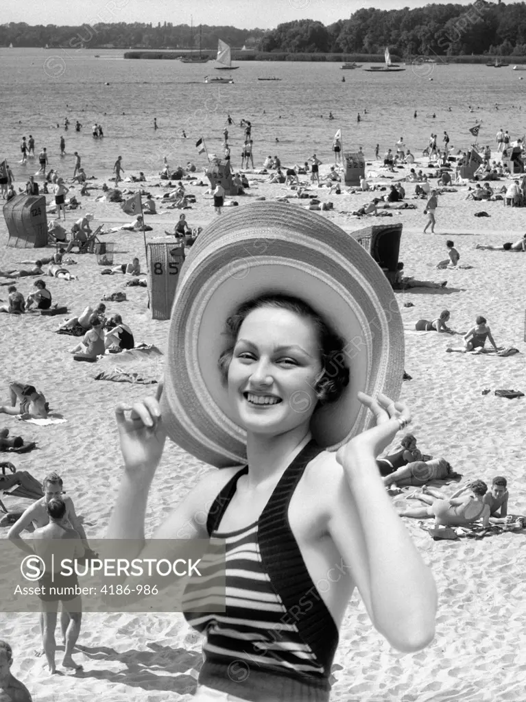 1930S Vacation Montage Portrait Smiling Woman In Bathing Suit Wearing Large Straw Hat And Scene Of Crowded Beach