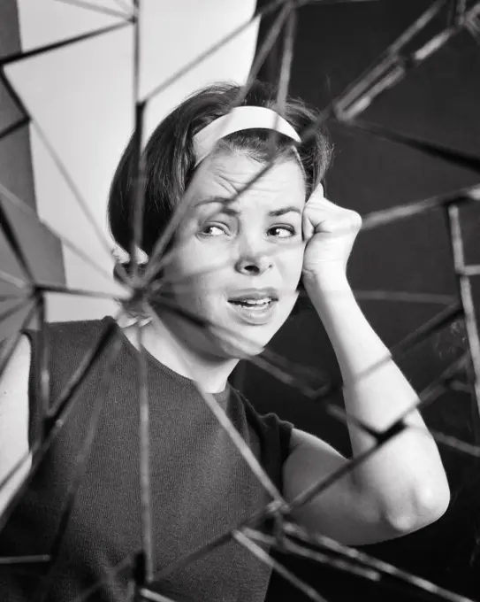 1960s COMPOSITE IMAGE UPSET WOMAN BROKEN MIRROR