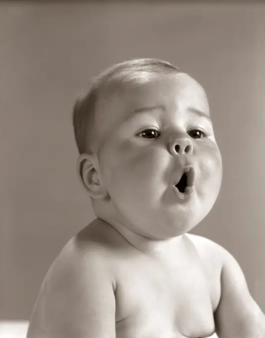 1960S Portrait Baby With Chubby Cheeks Making O Shape With Mouth