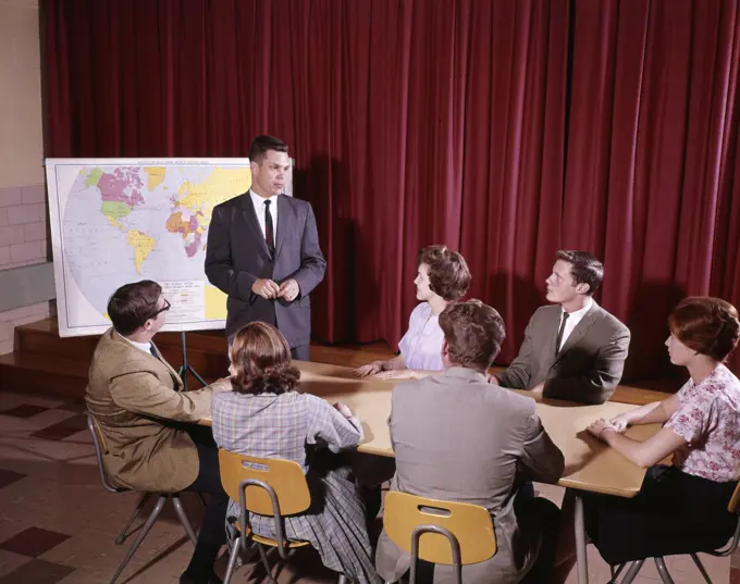 1960S Students And Teacher Around A Table In Student Government Meeting