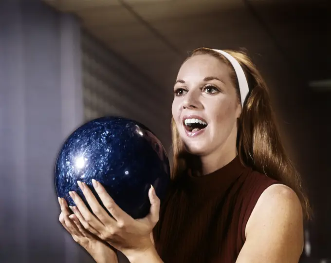 1960S Smiling Young Woman Holding Blue Bowling Ball