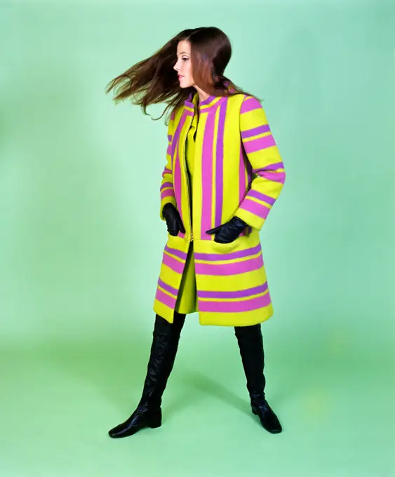 1960S Young Woman Wind Blown Hair Wear Green Purple Stripe Cloth Coat Thigh High Boots