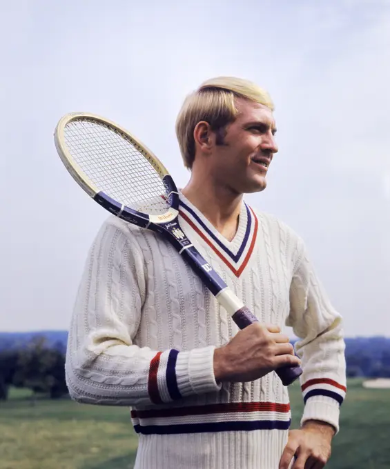 1970S Smiling Blond Man Wearing Cable Knit Sweater Holding Tennis Racket Over Shoulder