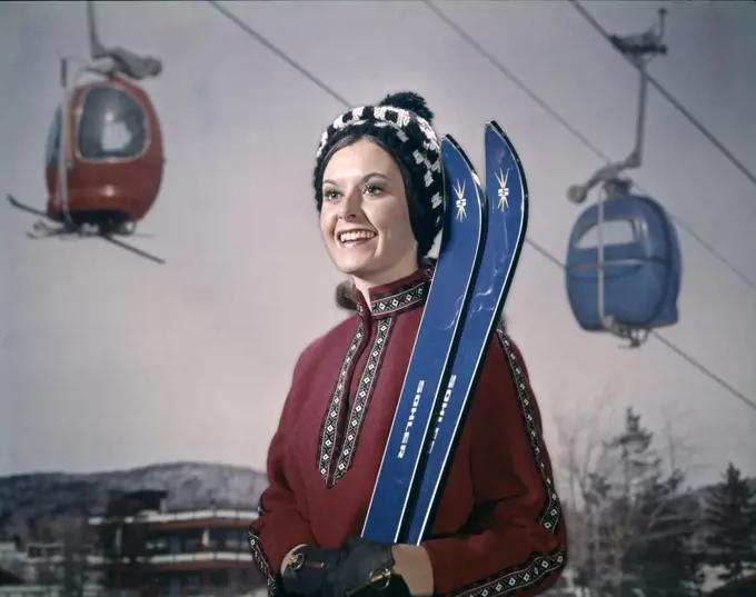 1950S Woman In Winter Gear Hat Holding Skis Ski Lift In Background
