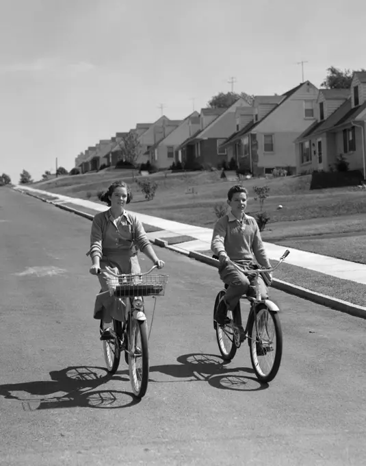 1950S Teen Boy Girl Riding Bikes Suburban Neighborhood Street