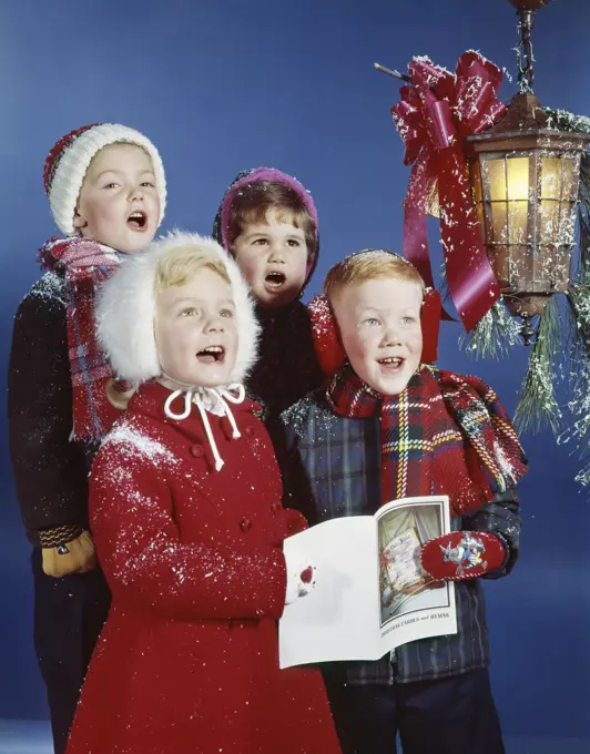 1960S Children Boys Girls Singing Christmas Carols Under Holiday Lantern