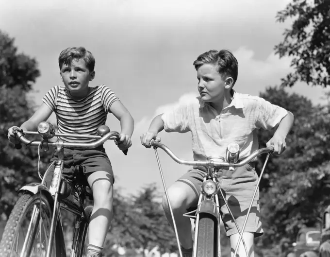 1940S Two Boys Riding Bikes