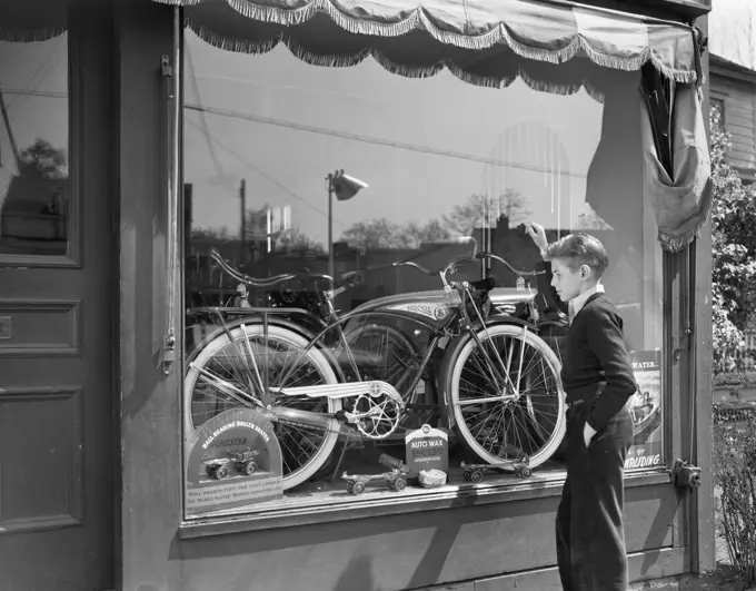 1950S Boy On Sidewalk Looking At Bicycle In Store Window