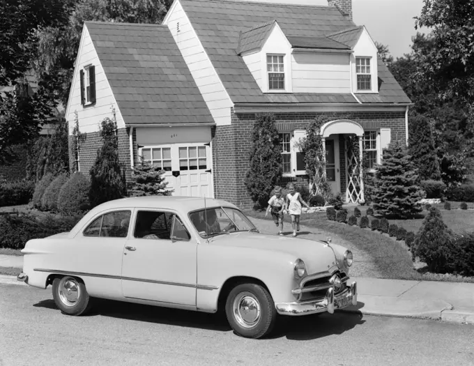 1940S 1950S Son & Daughter Running From House Towards 1948 Ford Automobile