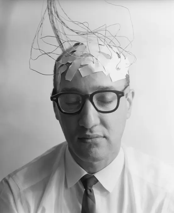 1960S Portrait Of Man Character With Wires Taped To Bald Head