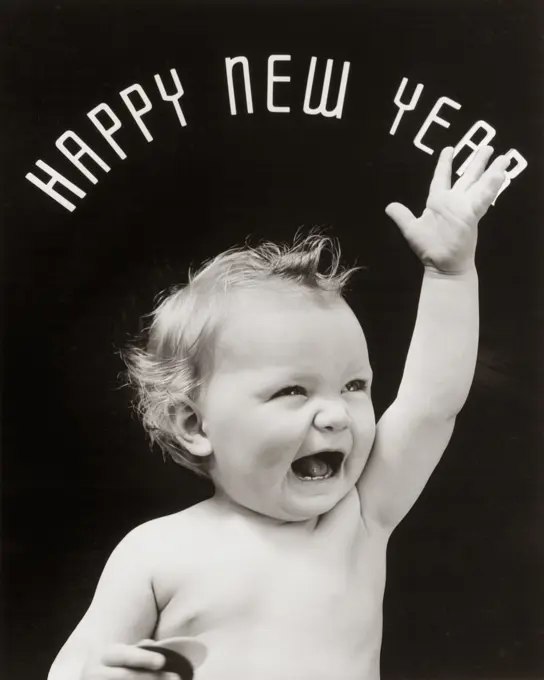 1930S Baby With Mouth Open And Hand Raised With Happy New Year Spelled Out In Arc Over Head