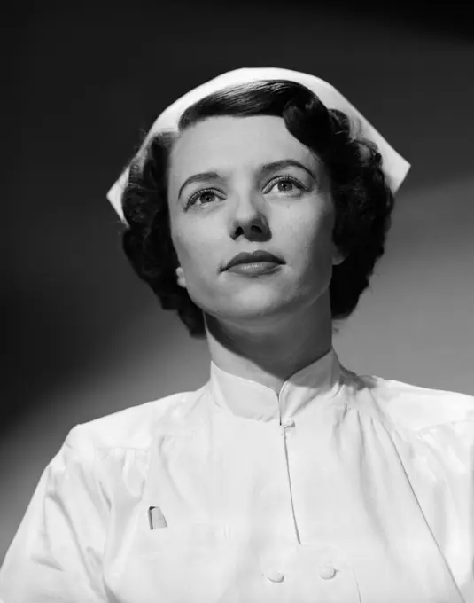 1950S Head Shoulders Portrait Nurse With Serious Express Straight On