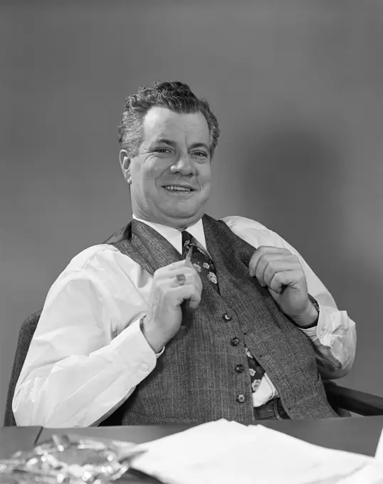 1940S Man In Suit Sitting At Desk Smiling