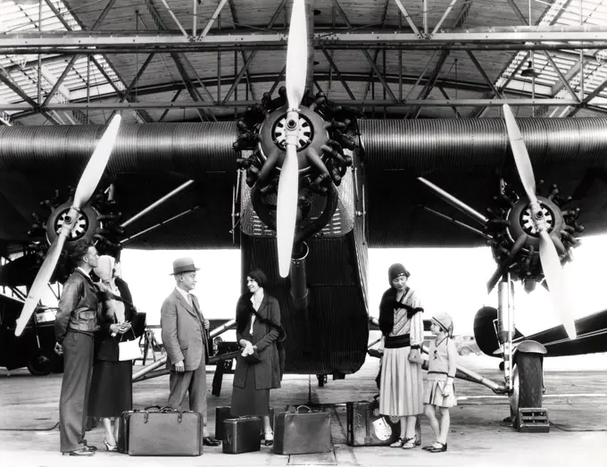 1920S 1930S Group Of Passengers Waiting In Front Of Ford Tri-Motor Airplane