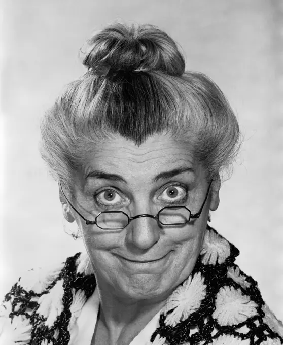 1970S Portrait Elderly Woman With Hair In Bun Wearing Granny Glasses Smiling