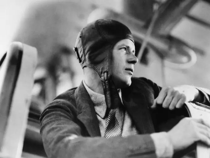 1920S Close-Up Of Charles Lindberg In Leather Aviator Cap Sitting In Cockpit Of Plane