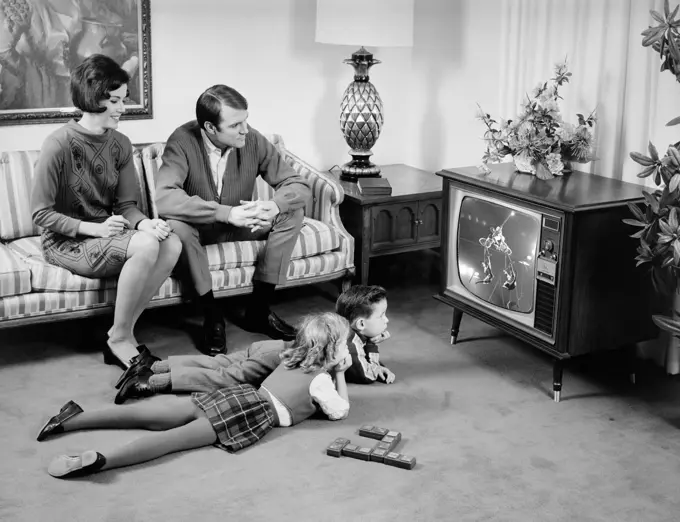 1960S Family Of 4 Watching Television