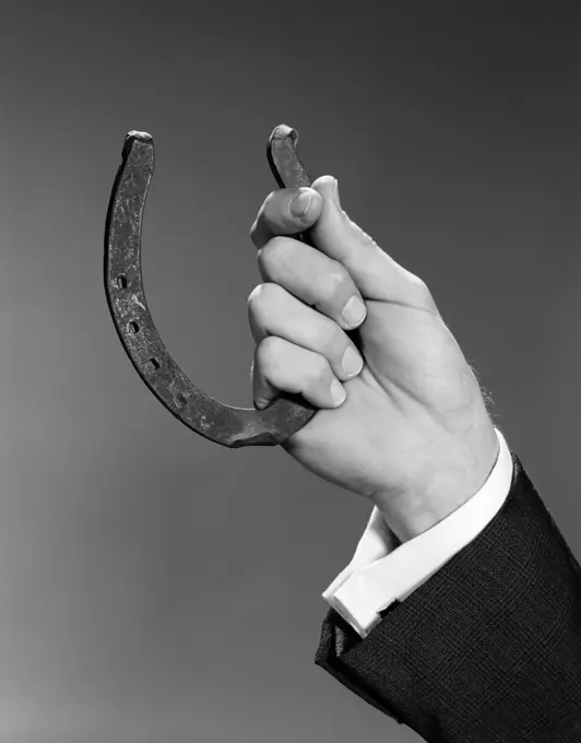 1960S Close Up Man'S Hand Holding Horseshoe Indoor