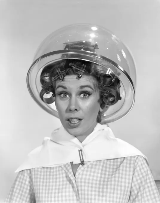 1960S Portrait Of Woman In Curlers Under Dryer