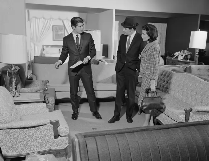 1960S Furniture Store Salesman Talking To Couple