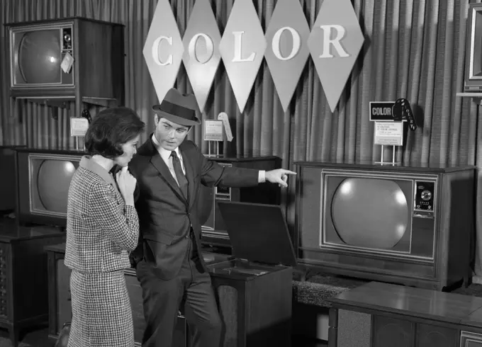 1960S Couple Shopping For Color Tv'S