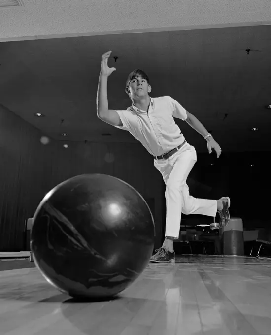 1970S Young Man Having Just Thrown A Bowling Ball