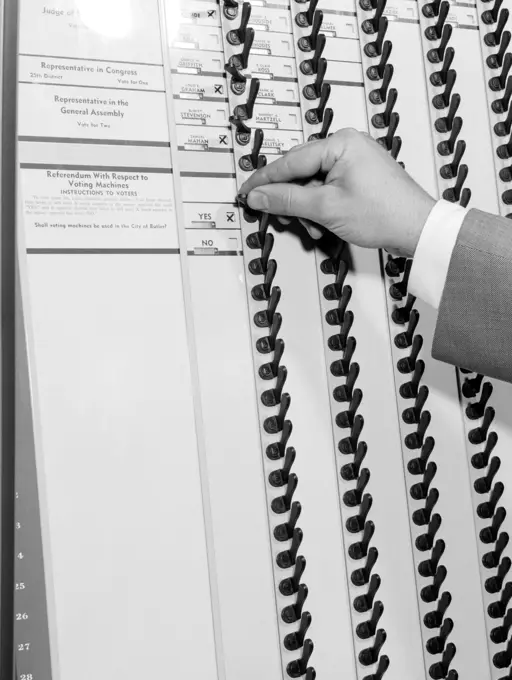 1950S Man'S Hand Pulling Levers In Voting Booth