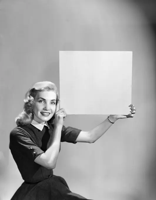 1950S Woman Holding Up Blank Sign