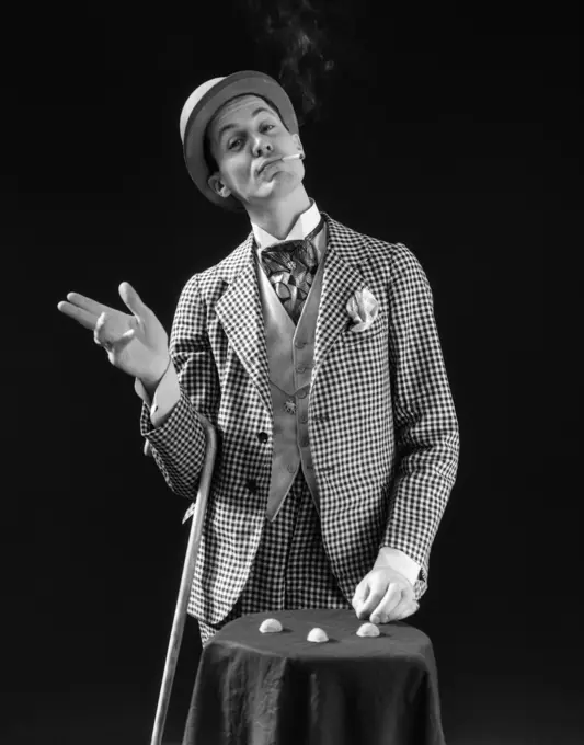 1930S Barker In Checkered Suit & Cigarette In Mouth Playing Shell Game