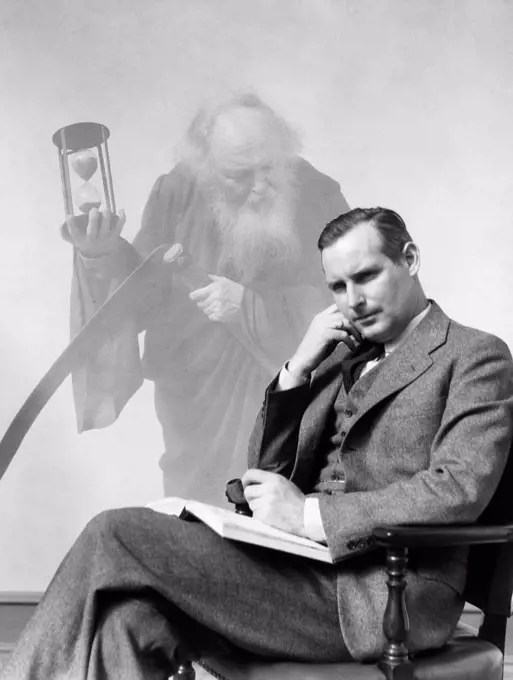 1930S Man In Suit Seated With Book In Lap & Pipe In Hand With Pensive Look With Grim Reaper Ghosted In Background