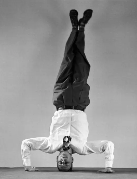 1950S Man In Shirt And Tie Standing On Head