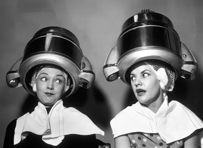 1950S Two Women Sitting Together Gossiping Under Hairdresser Hair Dryer