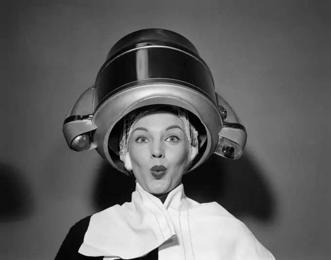 1950S Woman Under Hair Dryer With Towel On Shoulders And Hair Net