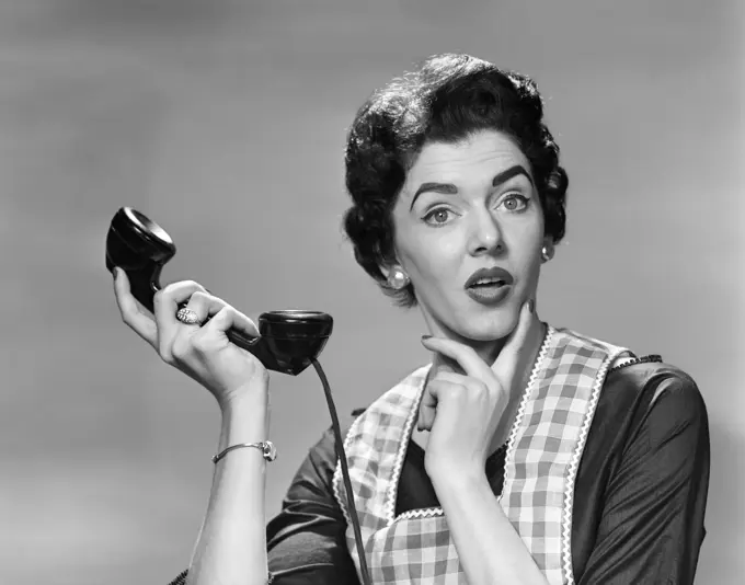 1950S Confused Woman Housewife Holding Up Telephone Receiver Facial Expression